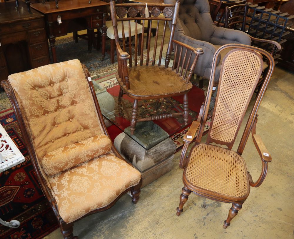 An early 20th century oak comb back elbow chair, a caned bentwood chair and a Victorian nursing chair